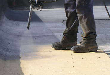Coating systems over Arvada spray foam roof systems